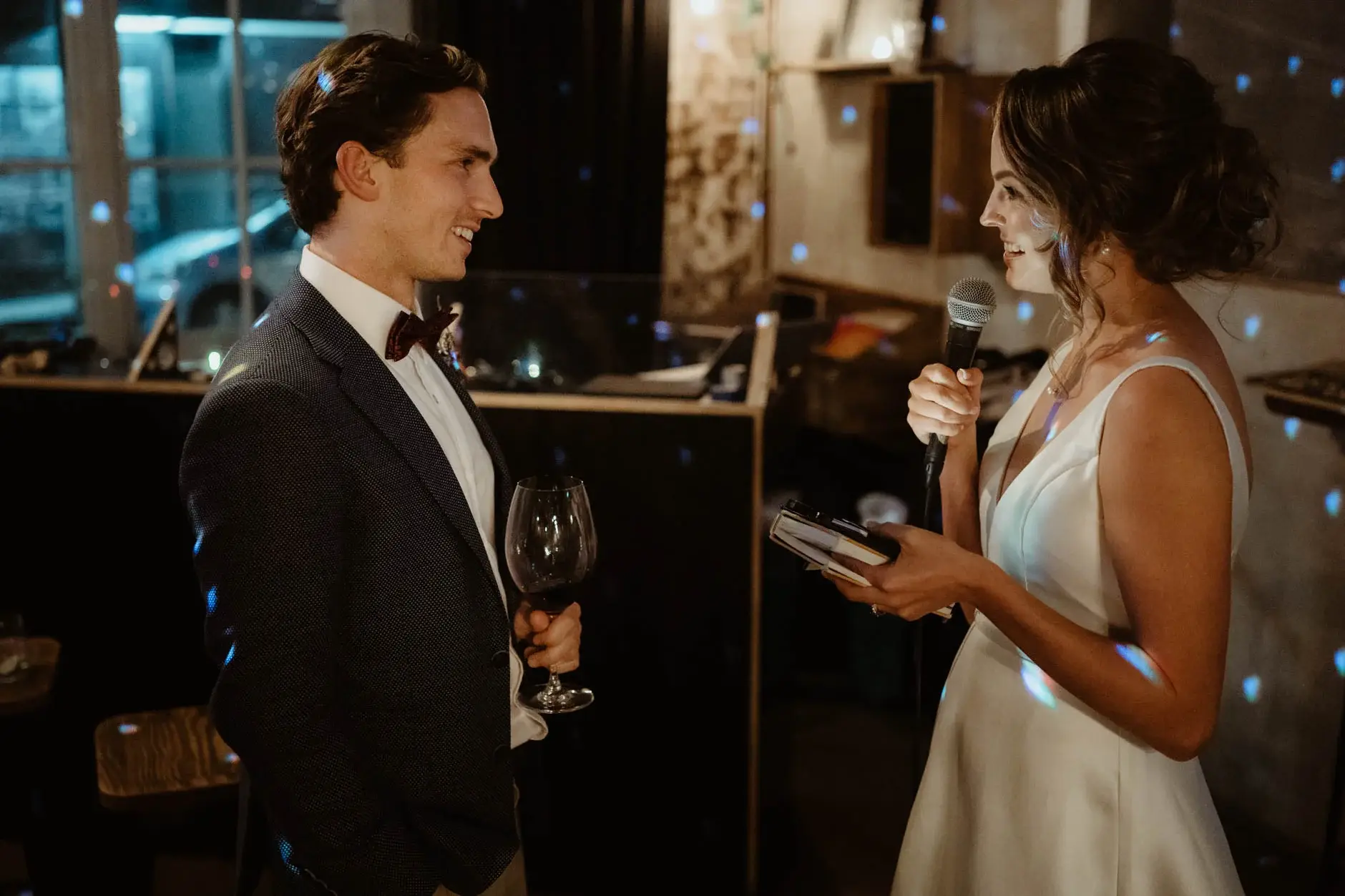 Kath speaking to the room with Ross beside her, Redfern