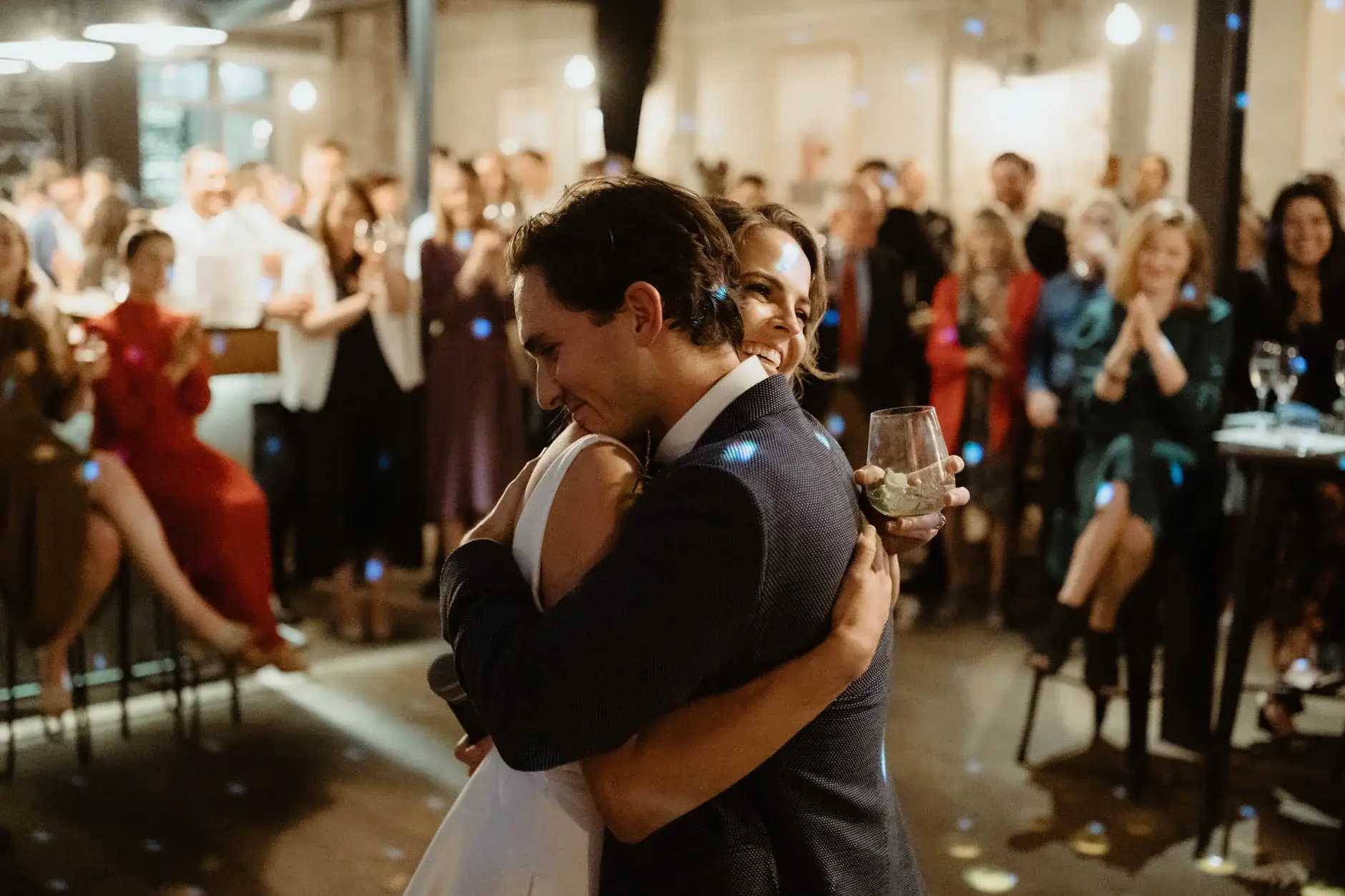 Kath and Ross holding each other in front of the guests, Redfern