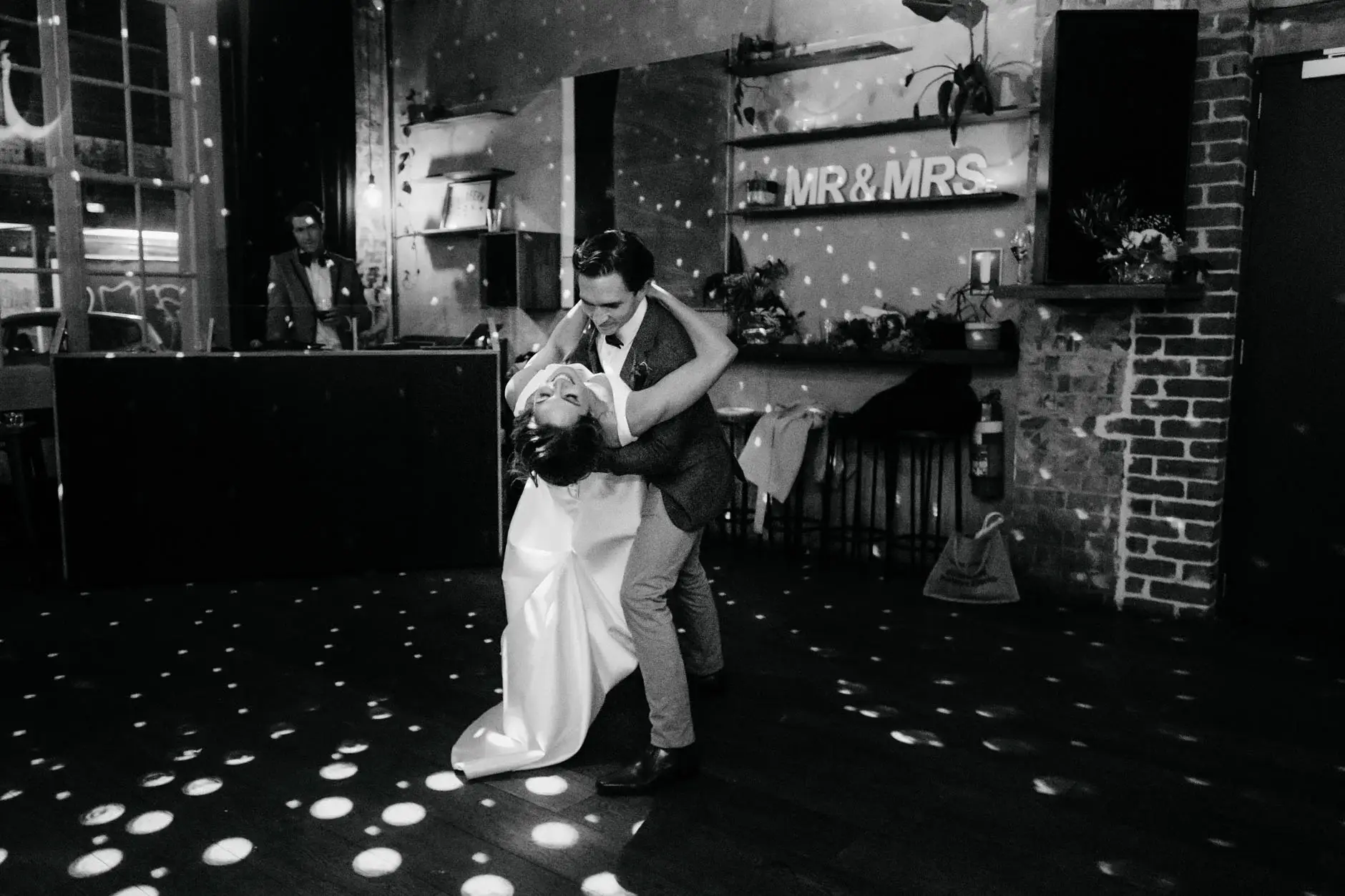 A dip during the first dance, black and white, Redfern