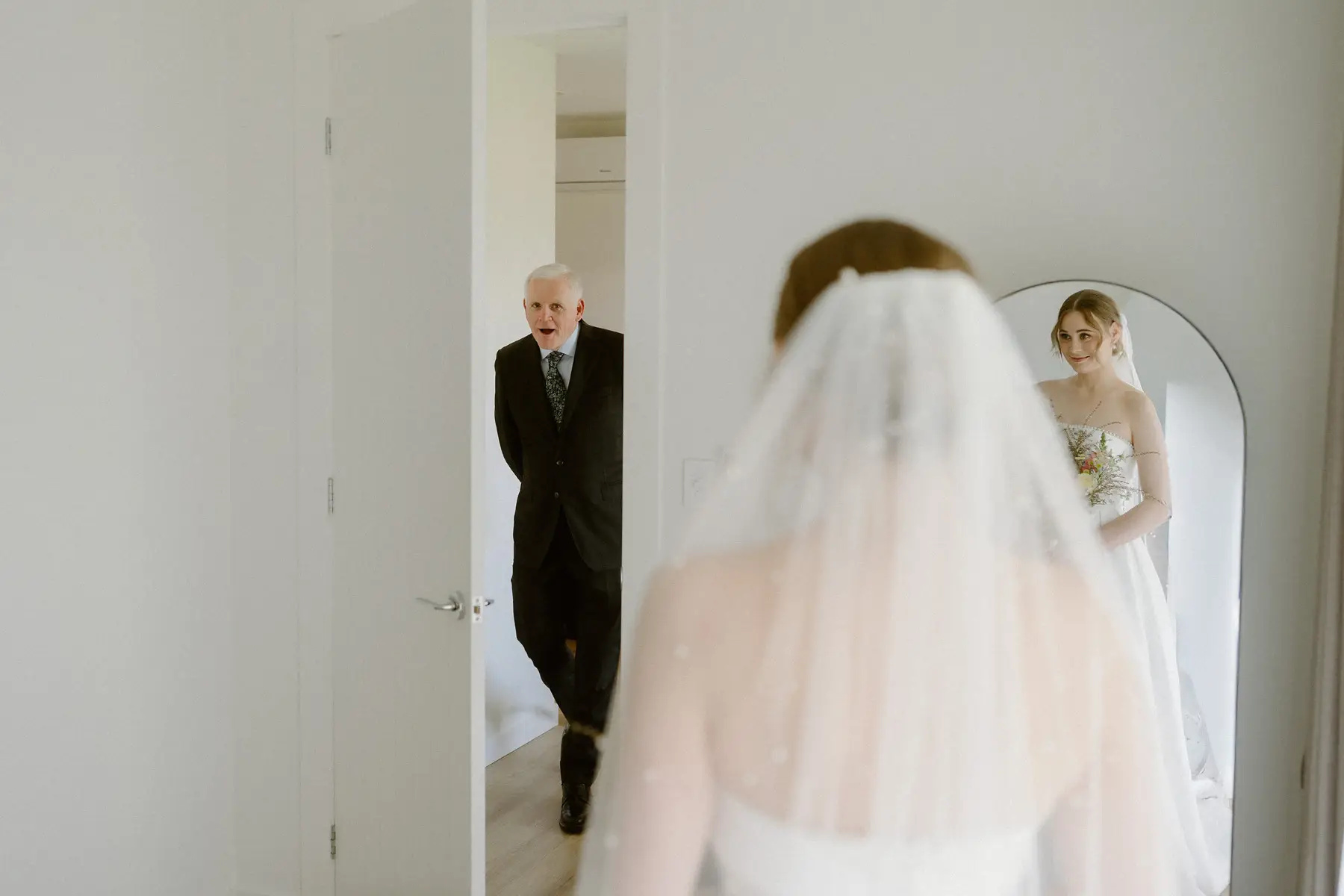 Nicole's father seeing her in her dress for the first time, caught in the mirror behind her veil, Kooroomba Vineyard and Lavender Farm