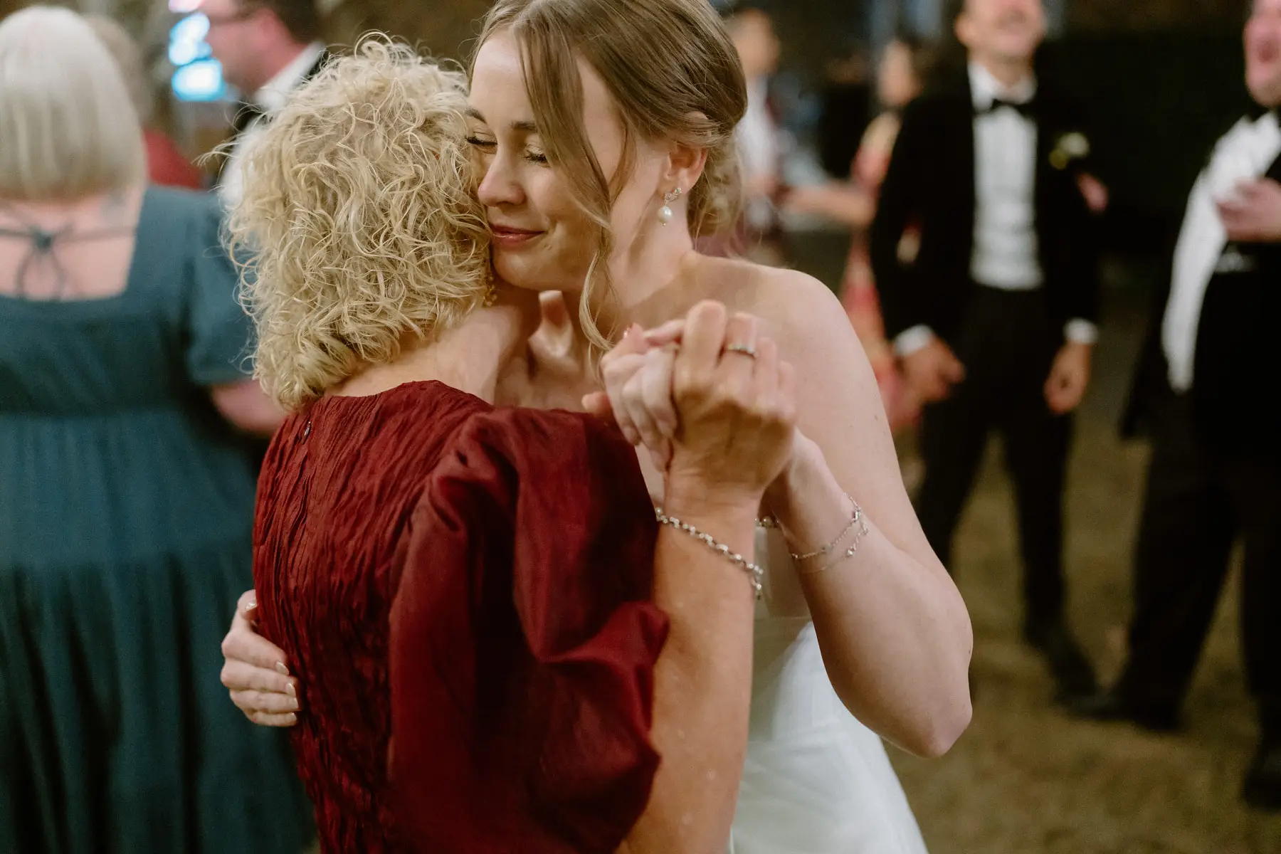 Nicole dancing cheek to cheek with a guest in red, Kooroomba Vineyard and Lavender Farm