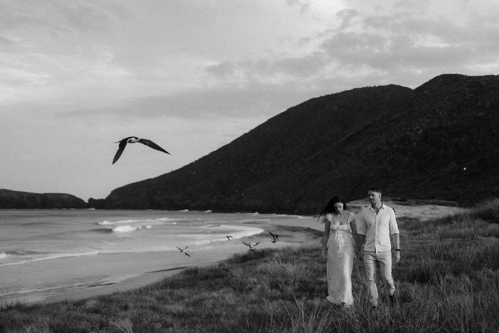 Mel and Brent small on the empty beach, Lord Howe Island