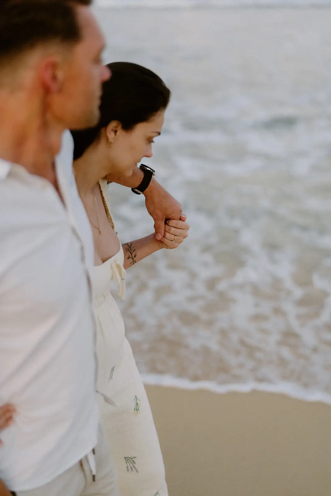 The couple standing together in the surf, Lord Howe Island