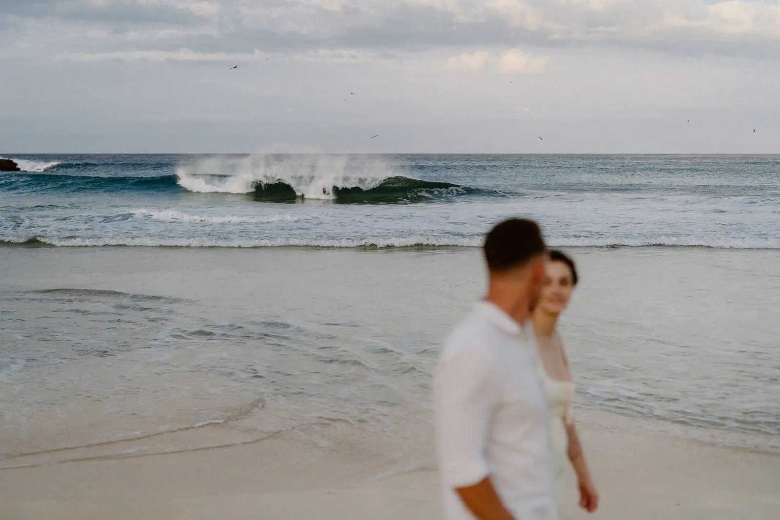 Brent on the beach with the waves behind, Lord Howe Island