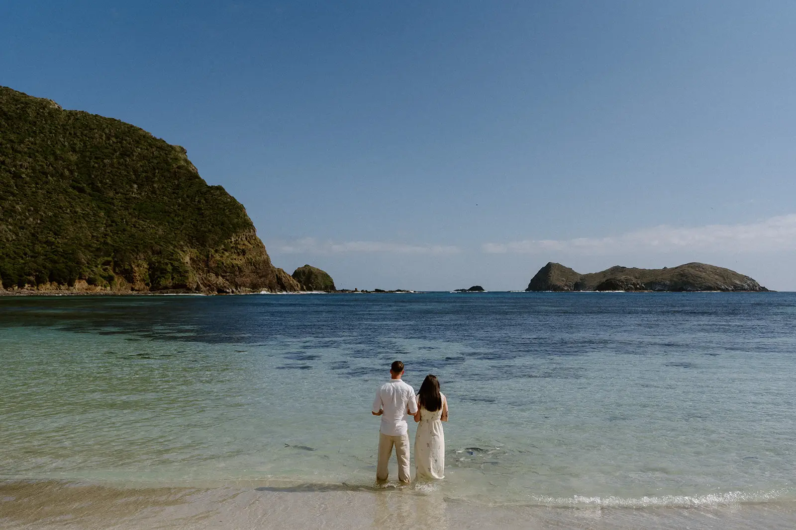 Mel and Brent standing in the turquoise lagoon, Lord Howe Island