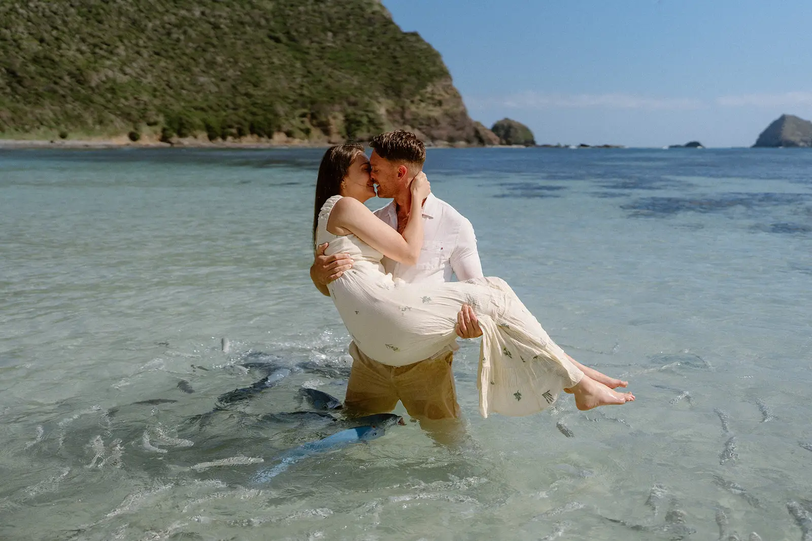 Brent carrying Mel through the water, Ned's Beach, Lord Howe Island