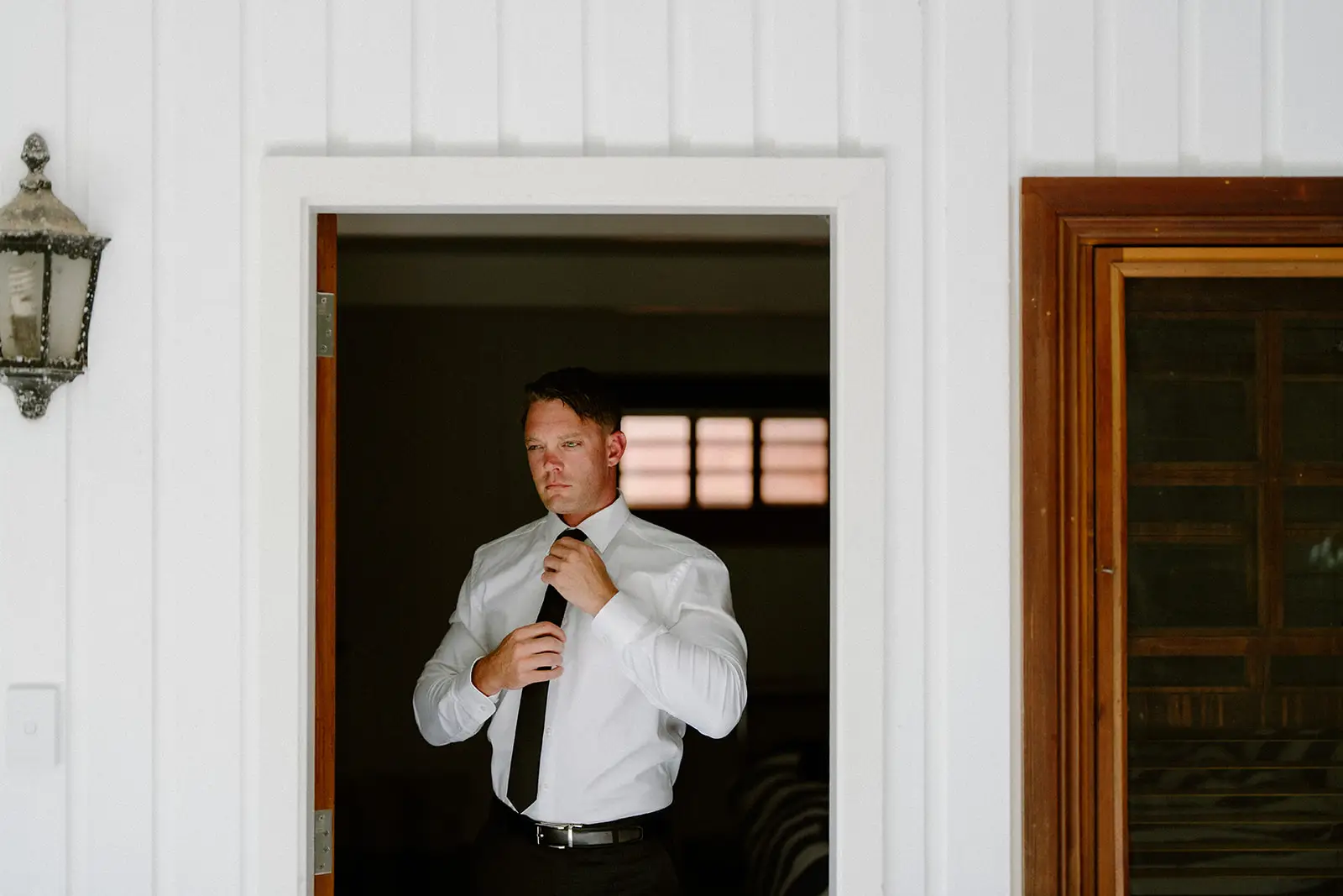 Brent putting on his jacket in the doorway, Lord Howe Island