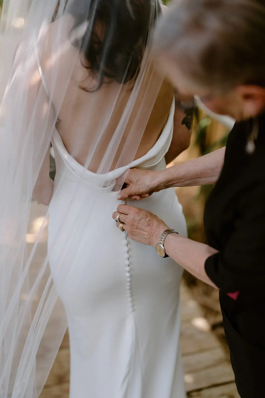 Mel being buttoned into her dress, Lord Howe Island