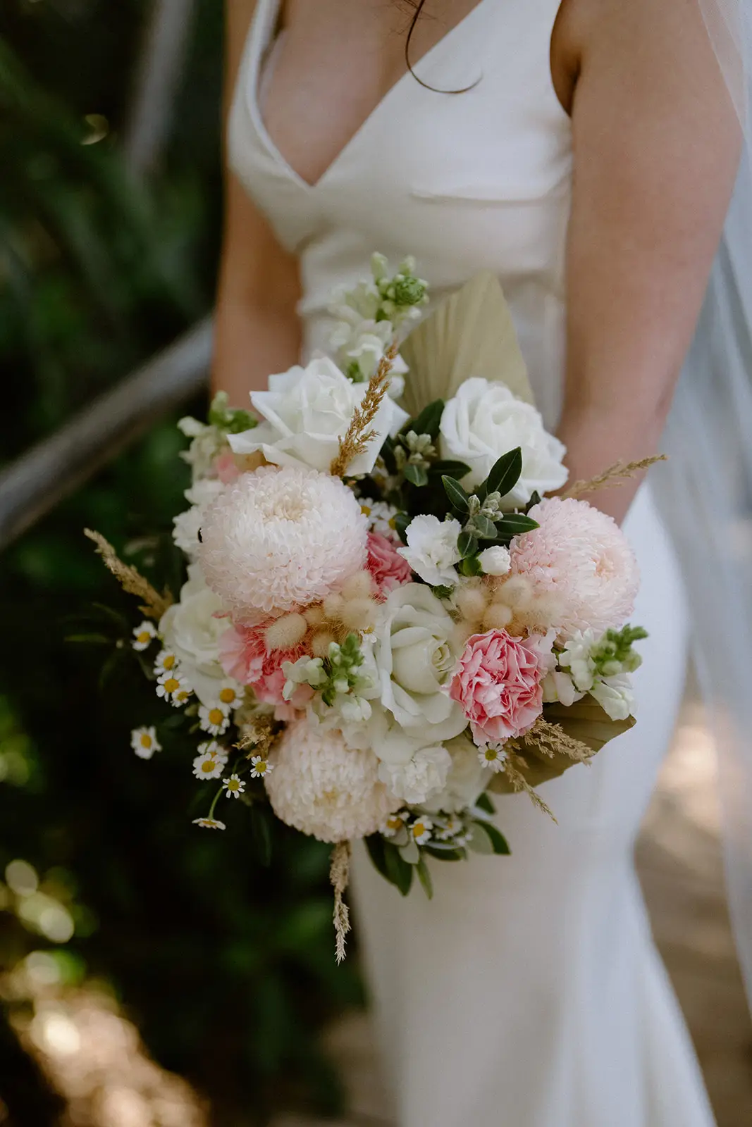 Mel holding her bouquet of pink and white garden roses, Lord Howe Island