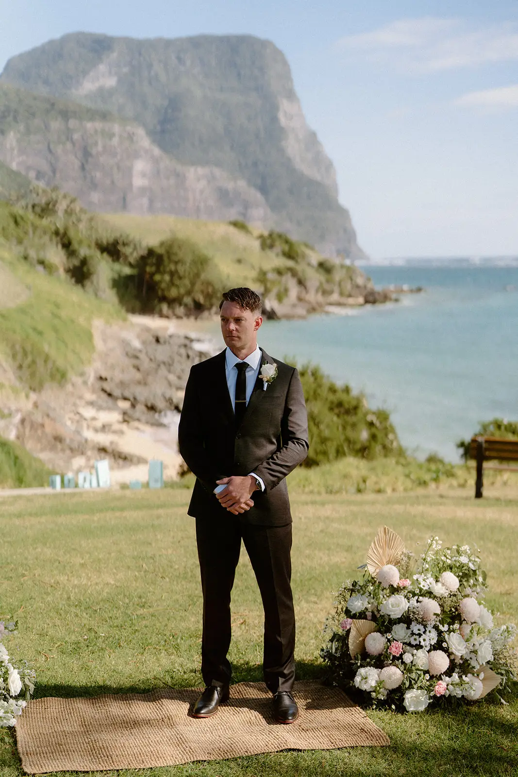 Brent waiting at the ceremony with the mountains behind, Lord Howe Island