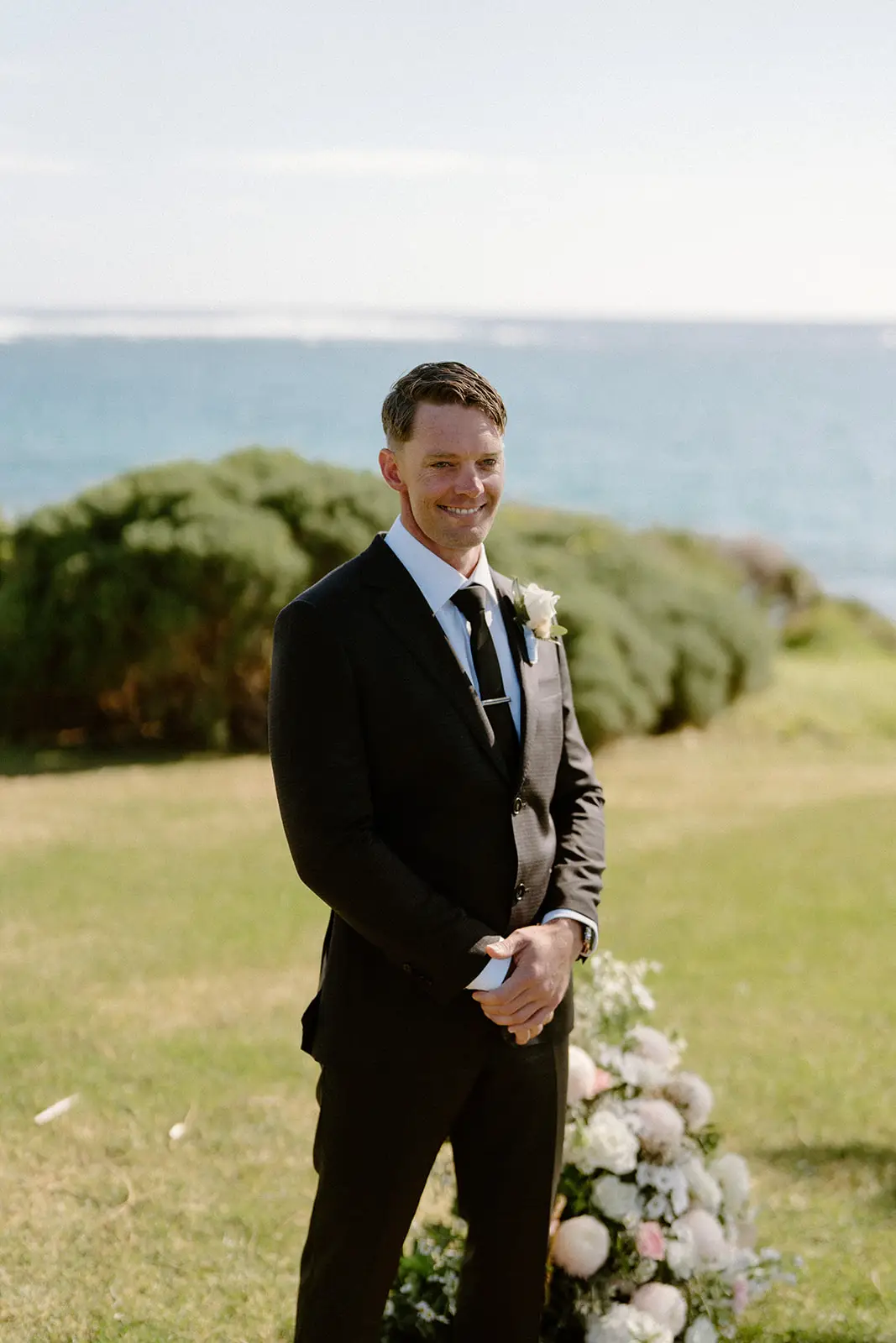 Brent at the altar with the flowers, Lord Howe Island