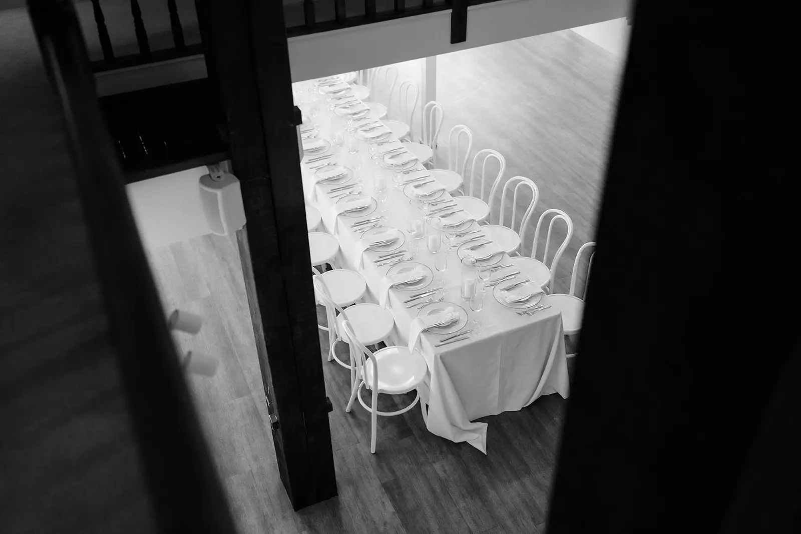 Black and white — the long table seen from the doorway, Maleny Manor