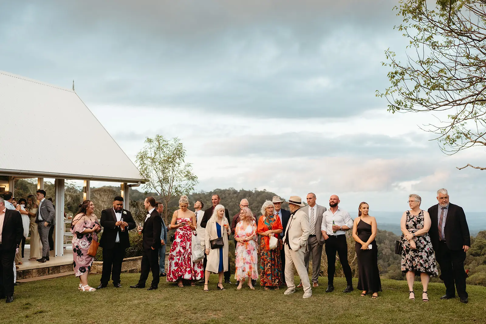 Guests lined up outside the pavilion with the valley behind, Maleny Manor