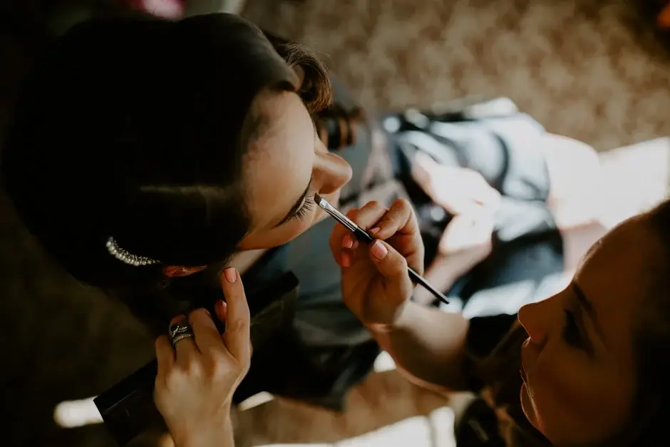 Amanda having her eye makeup done before the wedding, Riverside
