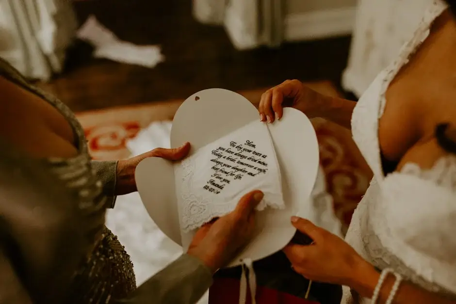 A hand-lettered note being read from a folded card, Riverside
