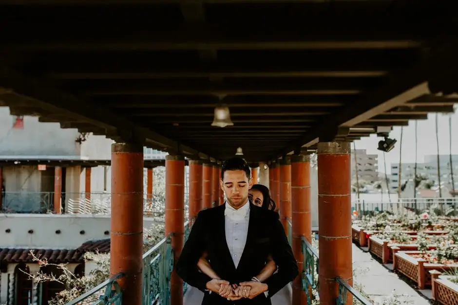Aaron standing beneath the beamed colonnade, Riverside