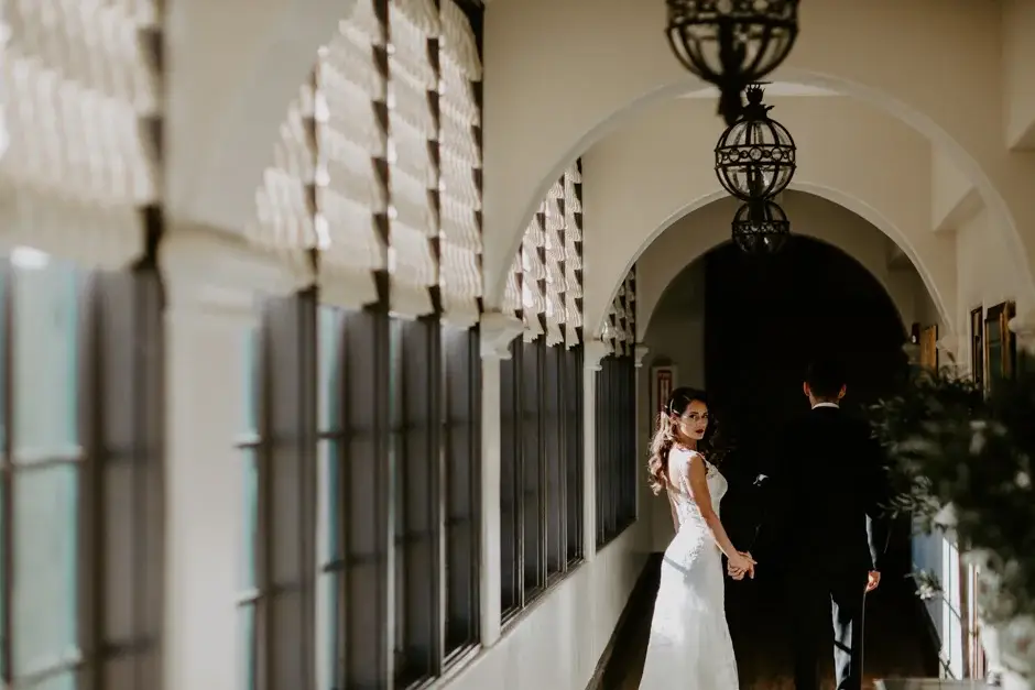Aaron and Amanda in a long arched corridor, Riverside