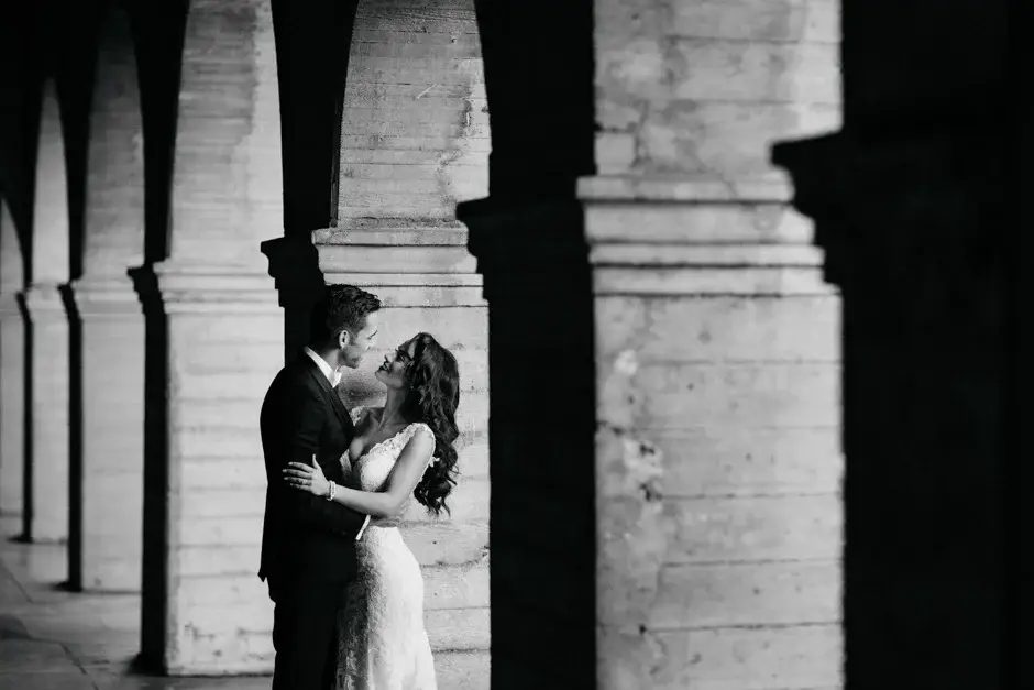 Aaron and Amanda between the stone pillars, black and white