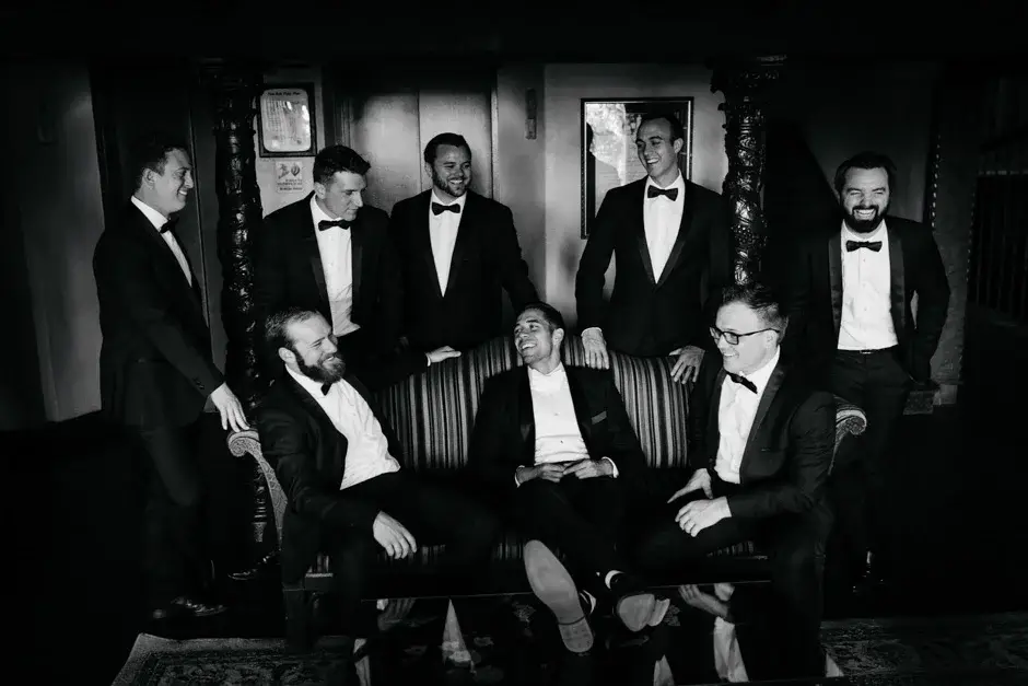 The groomsmen in black tie together, black and white, Riverside