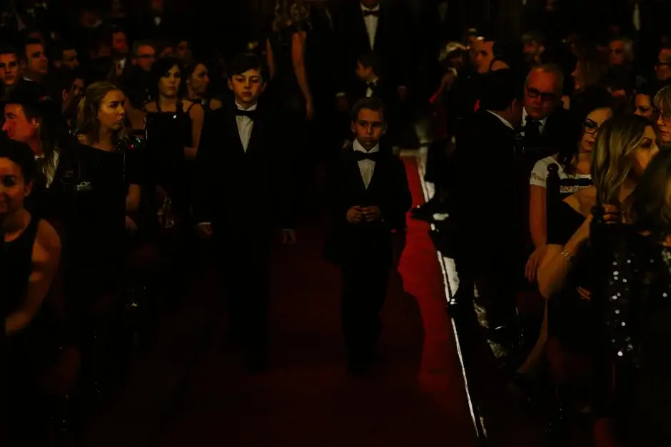 Guests in black tie waiting in the chapel, Riverside
