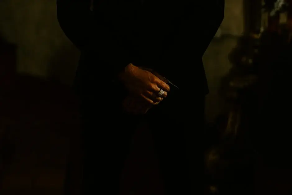 A hand holding a glass in the low light, Riverside
