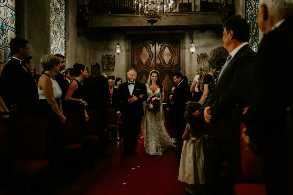 Amanda coming down the aisle past the guests, Riverside