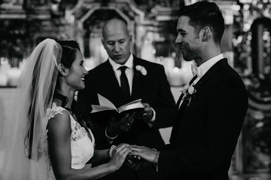 The exchange of vows at the altar, black and white, Riverside