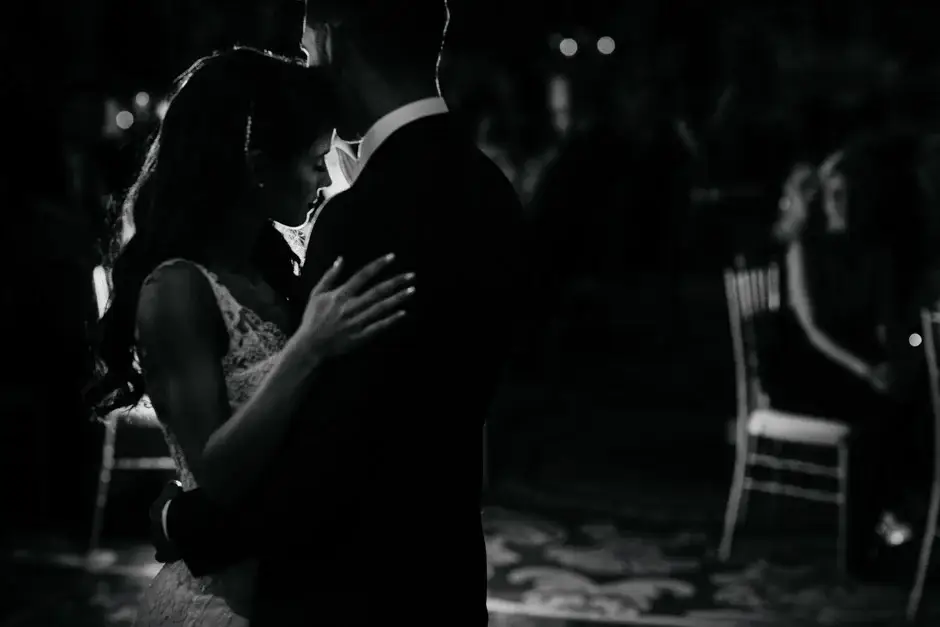 A close dance in the low light, black and white, Riverside