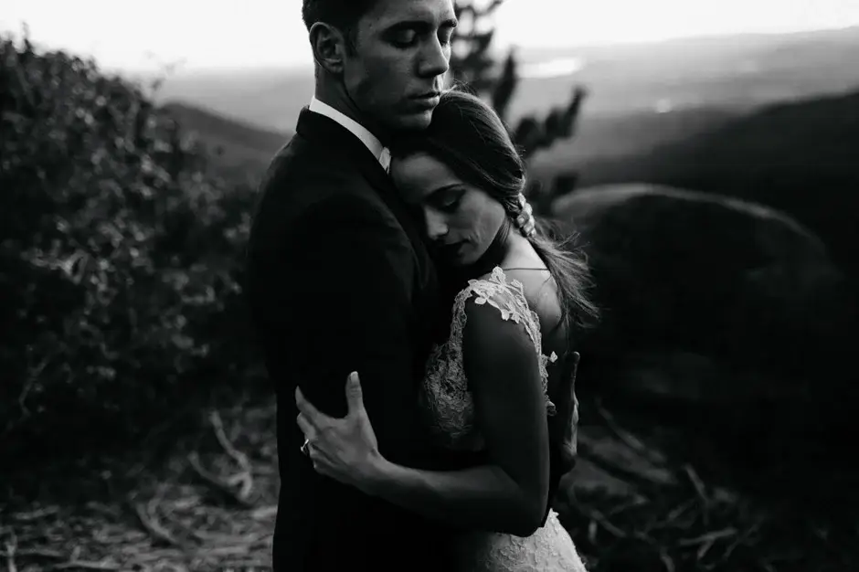 A hillside embrace at dusk, black and white, California
