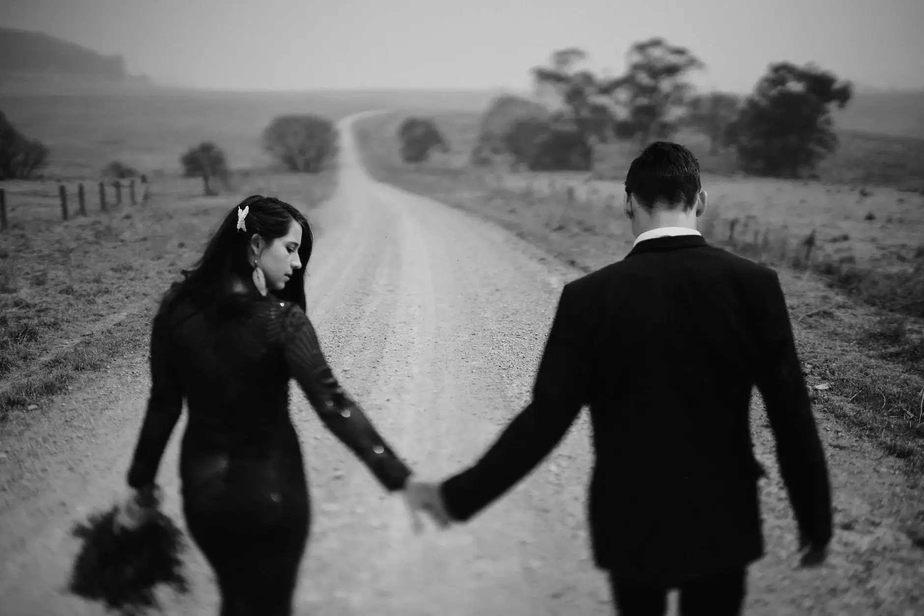 Walking the gravel road hand in hand, black and white, New England