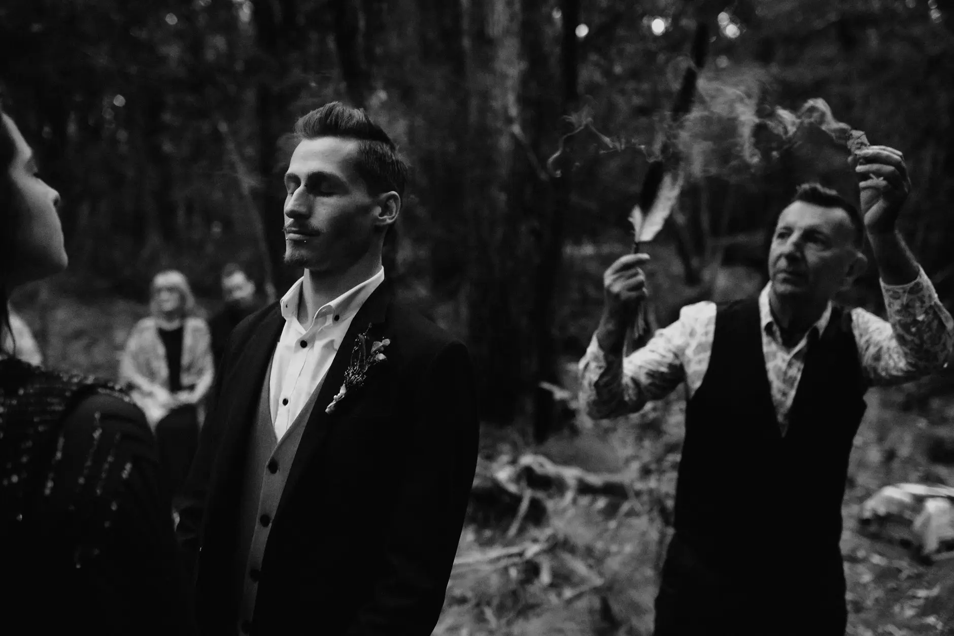 Drew and the celebrant during the ceremony, black and white