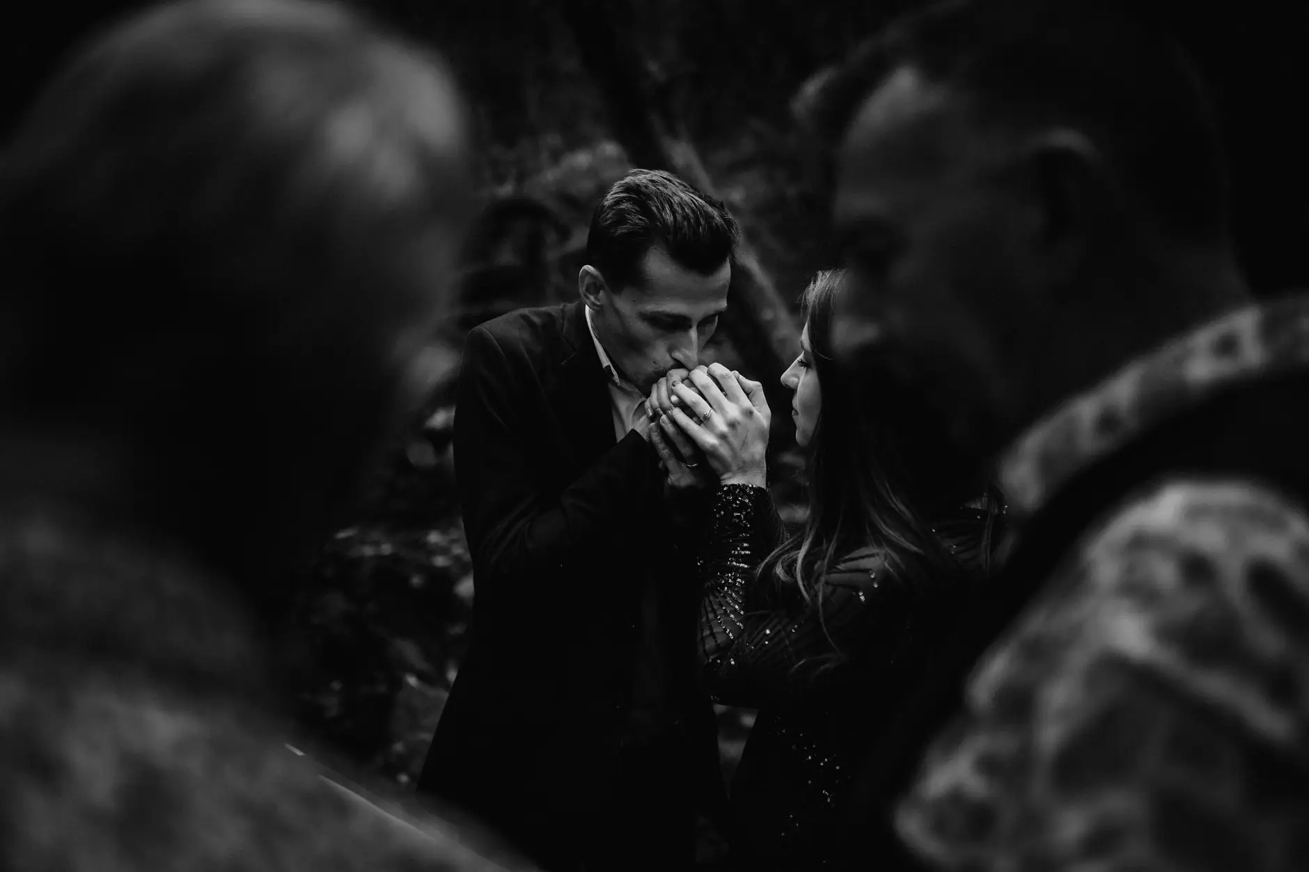 Drew wiping his eyes with the celebrant beside him, black and white