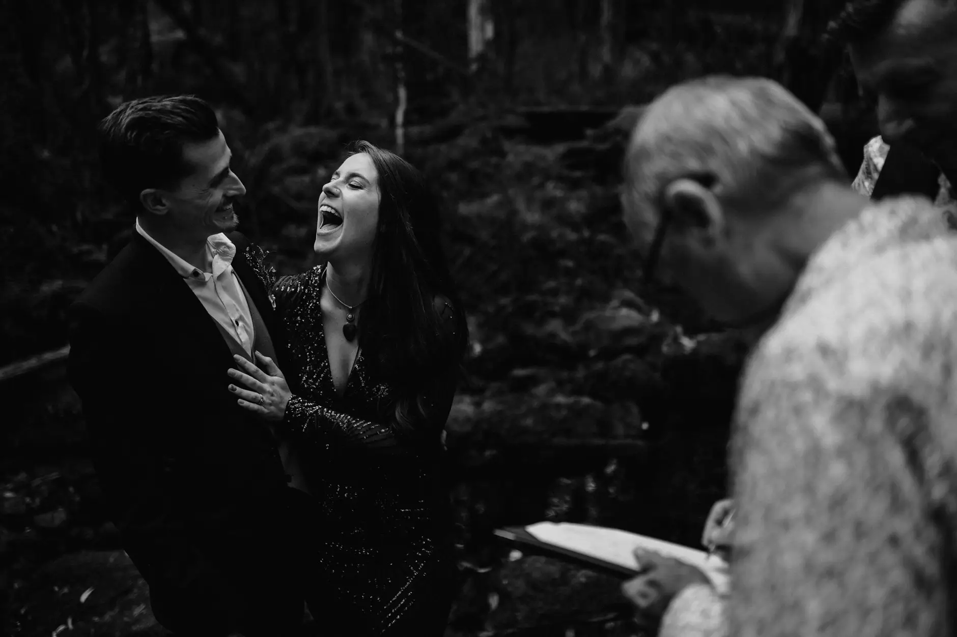 Jess and Drew laughing with the celebrant, black and white, New England
