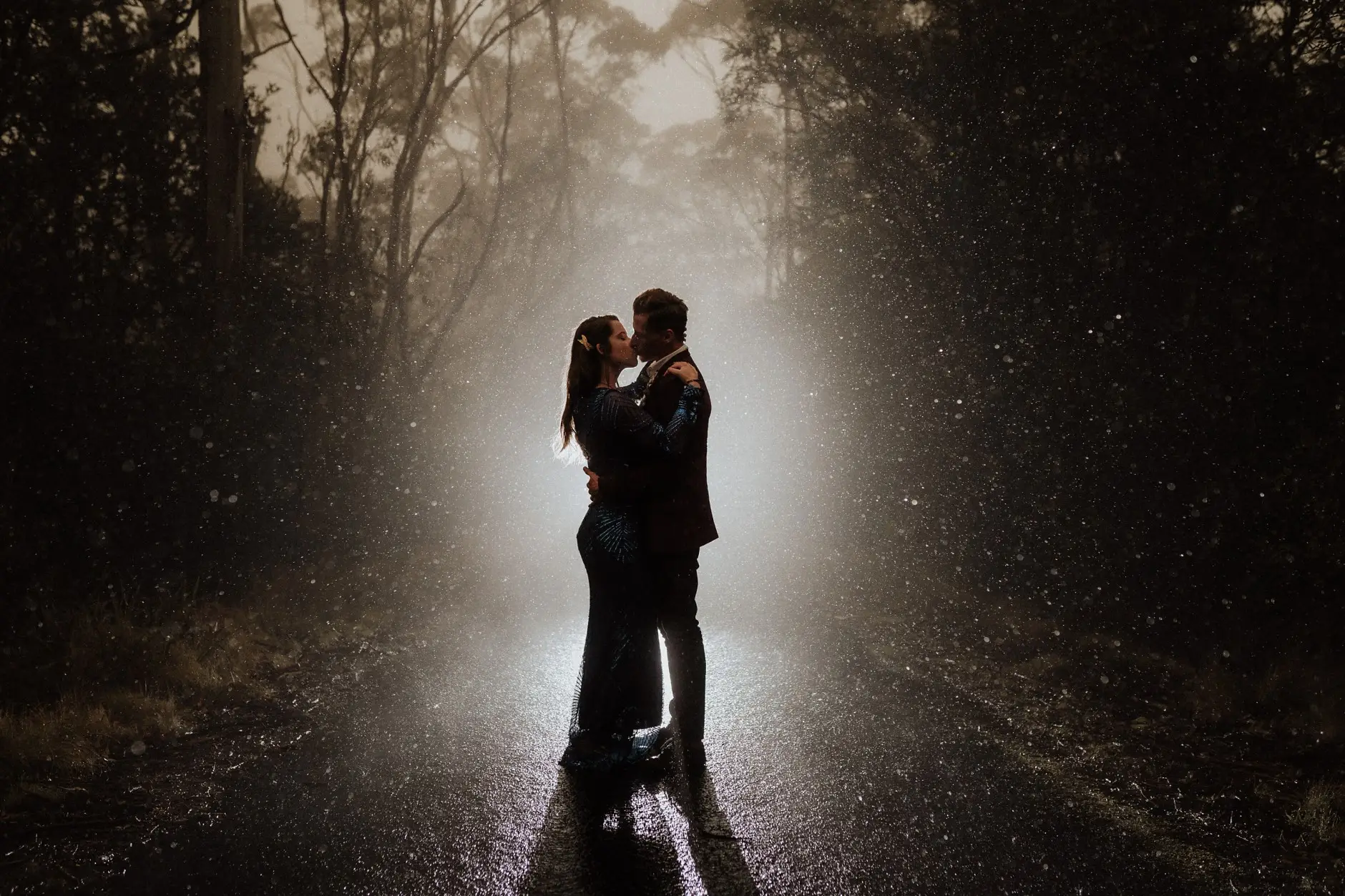 Holding each other in the rain and backlight, New England