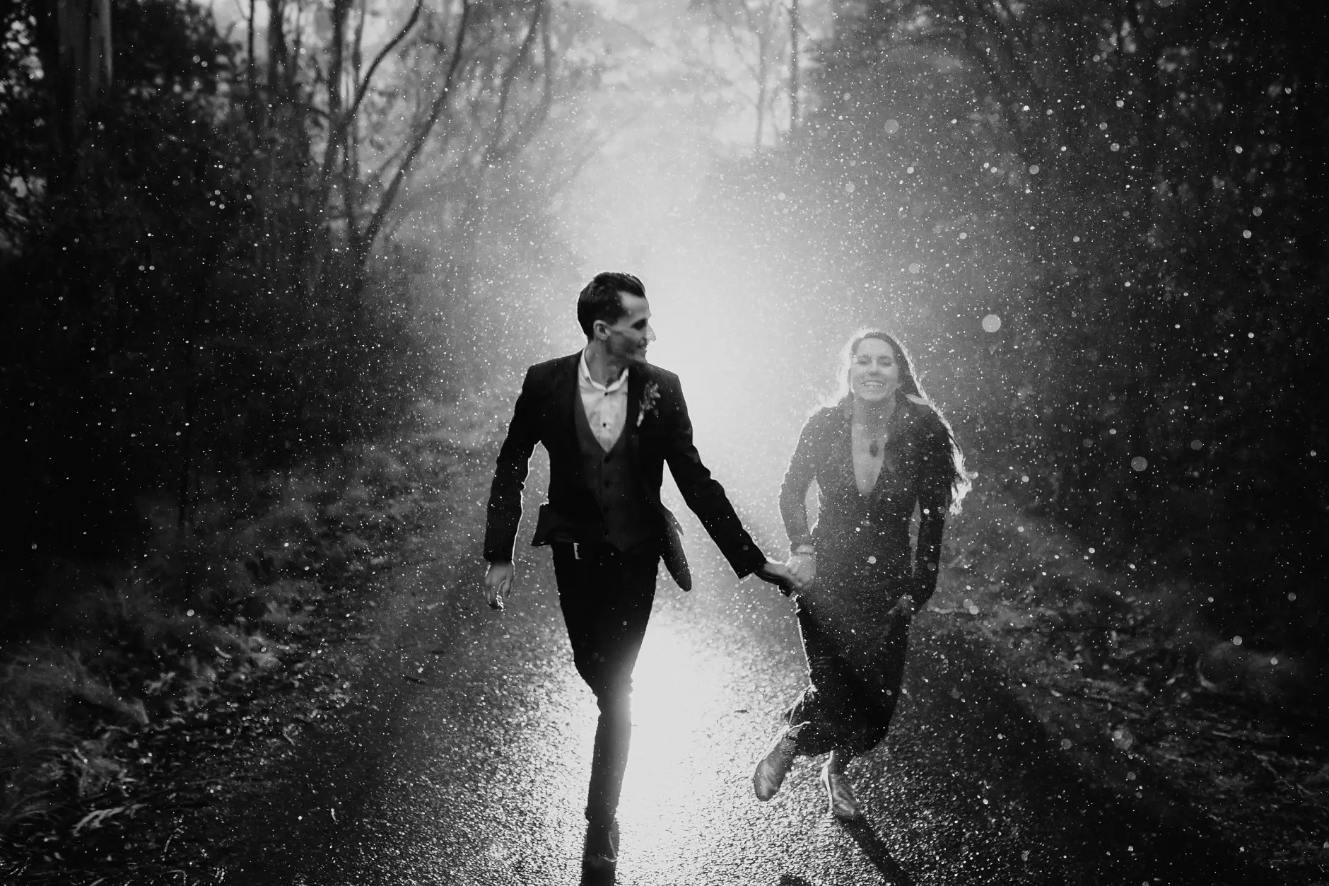 Running through the rain on the road, black and white, New England