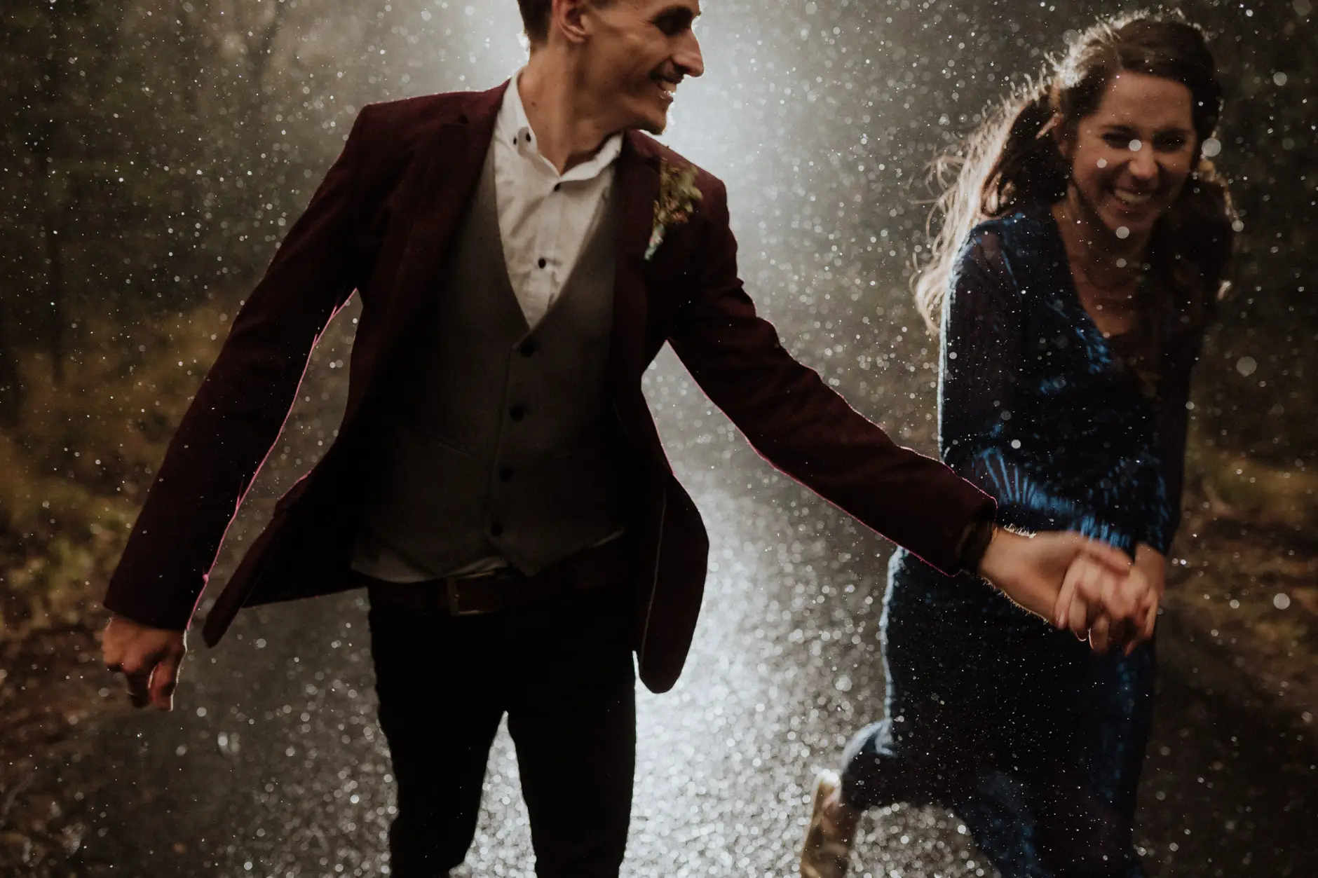 Running through the rain, hands linked, New England National Park