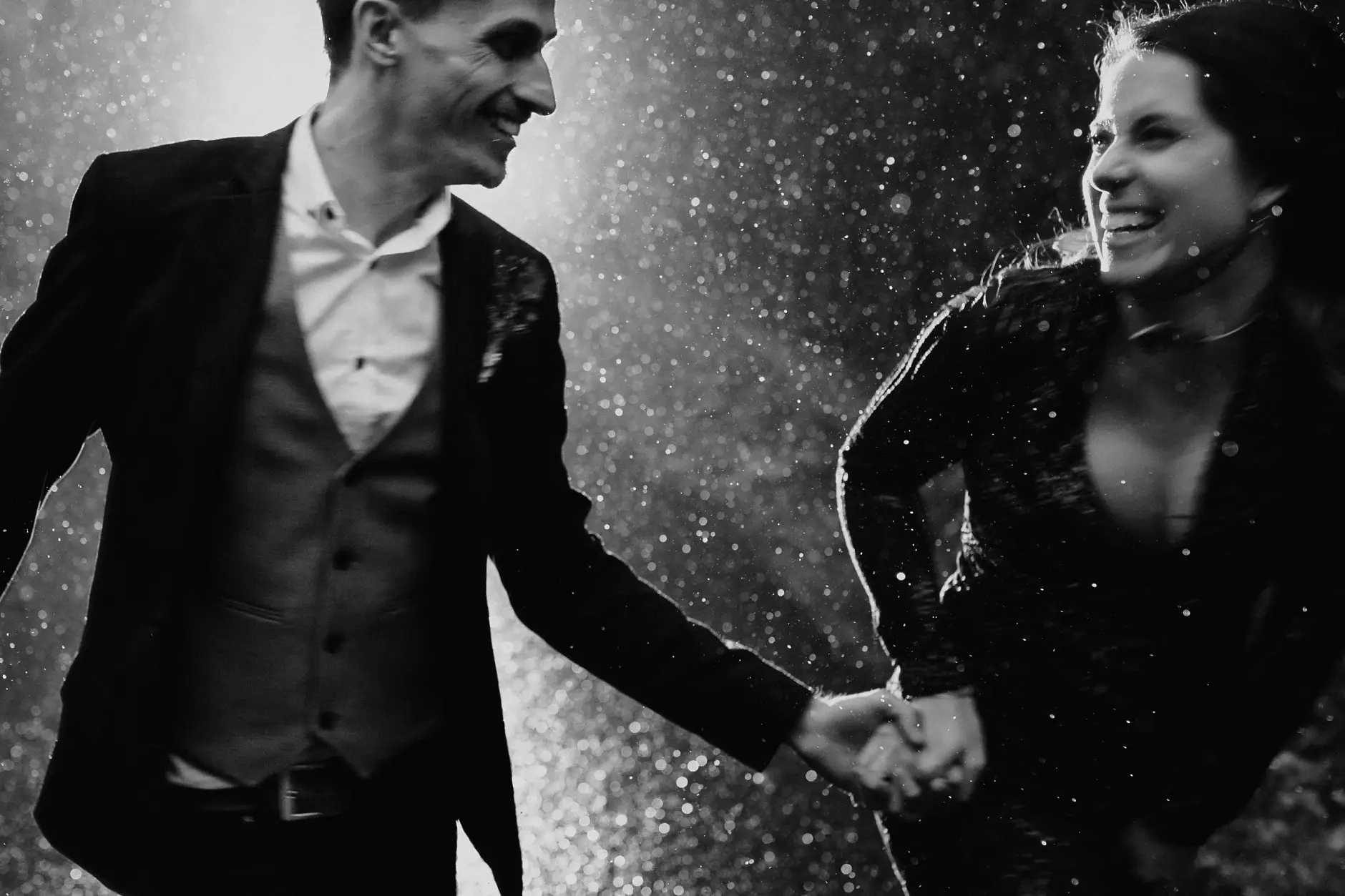 Running and laughing in the rain, black and white, New England