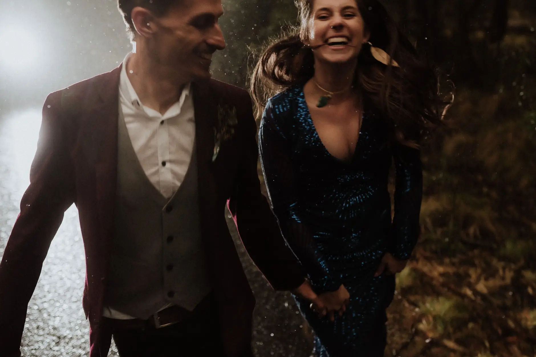 Jess and Drew laughing in the rain, New England National Park