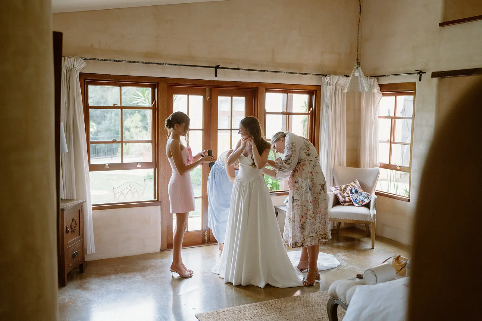 Getting ready in the villa, light coming through the timber-framed windows, Nutting Hill Villa