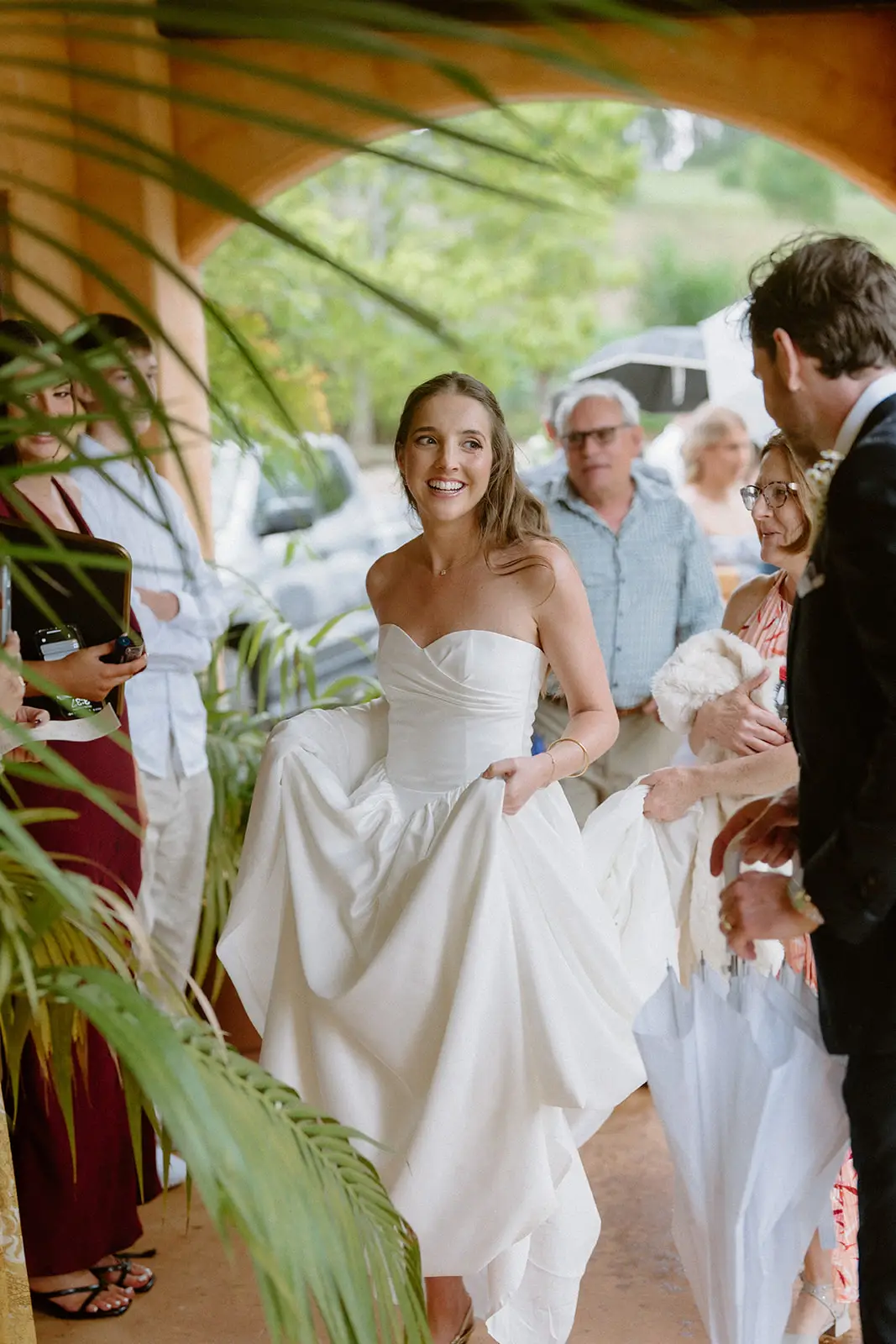 Guests crowding in through the palms after the ceremony, Nutting Hill Villa