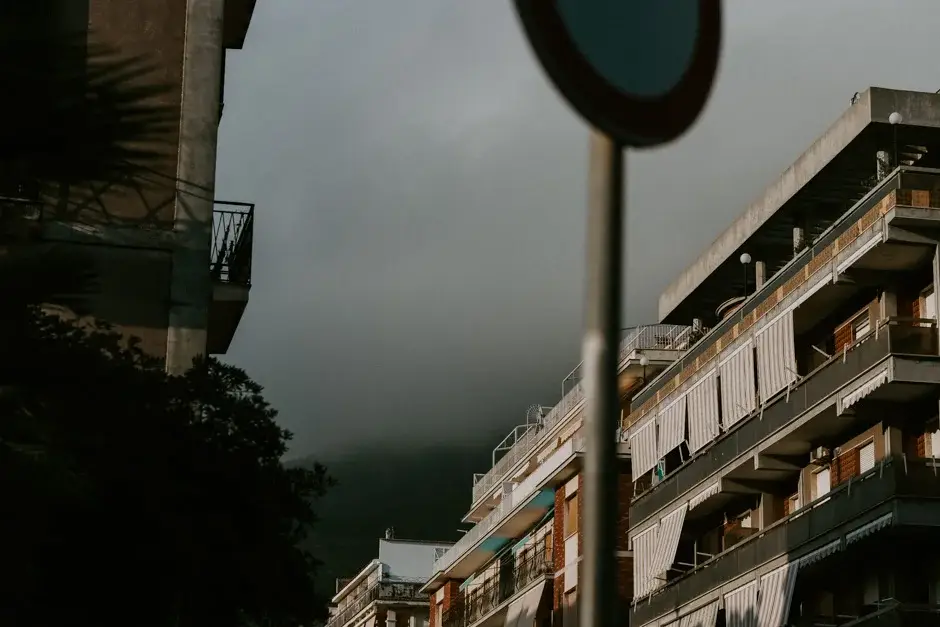 Apartment balconies below the cloud-covered hills, Amalfi Coast