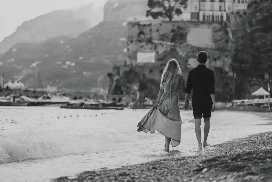 Emilie and Henrik walking the pebble beach, black and white