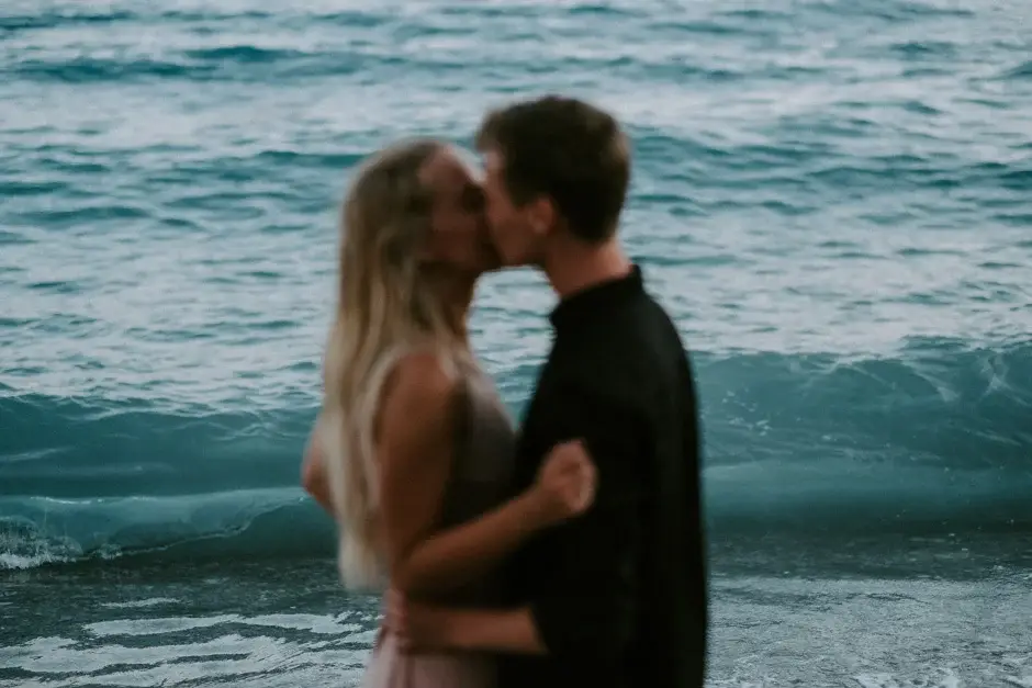 Emilie and Henrik kissing in the surf, Amalfi Coast