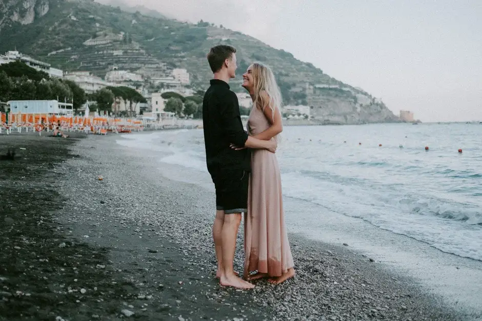 Emilie and Henrik standing together on the shore, Amalfi Coast