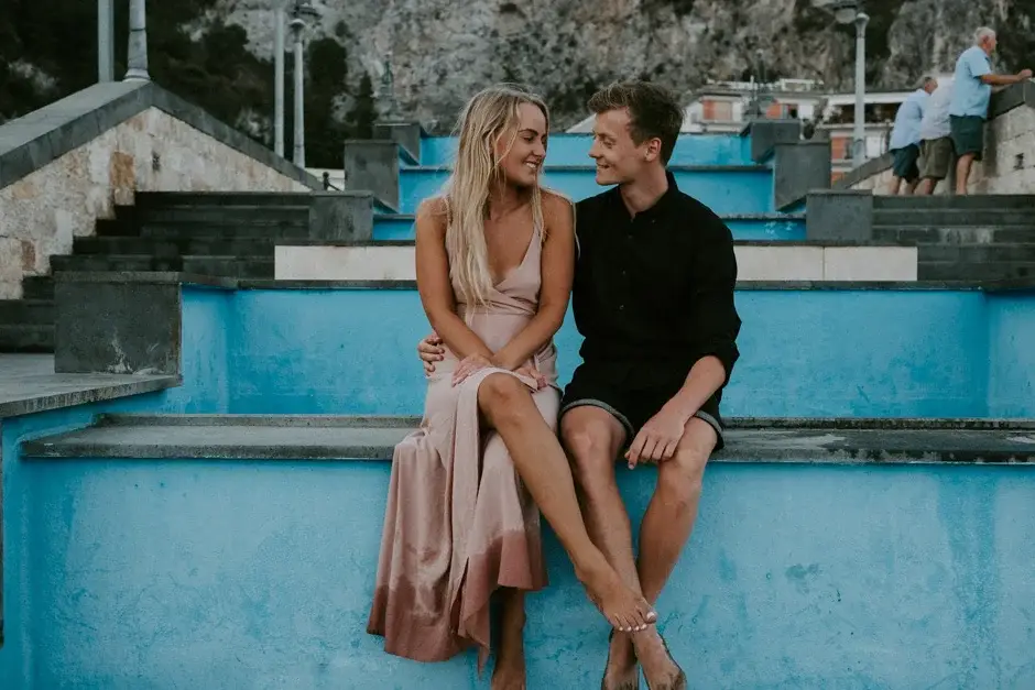Sitting together on the blue-painted steps, Amalfi Coast