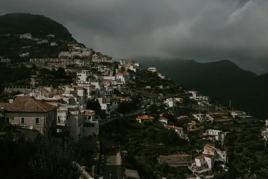 The houses of Ravello stacked up the hillside under cloud