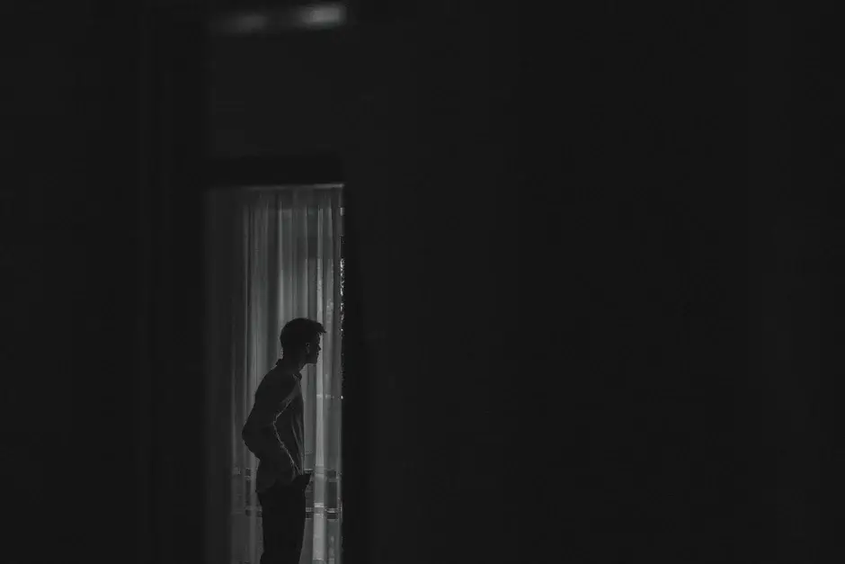 Henrik in silhouette in the doorway, black and white