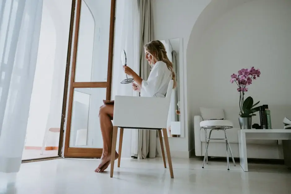 Emilie sitting at the dressing table by the open window, Ravello