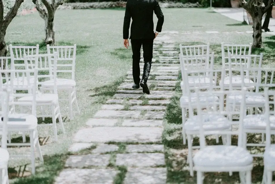 Henrik walking between the white ceremony chairs, Ravello