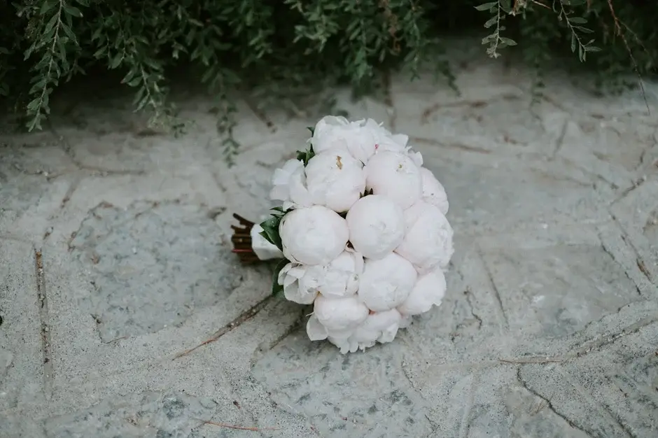 Emilie’s white peony bouquet resting on stone, Ravello